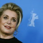 Cast member Deneuve poses during a photocall to promote the movie "Dans La Cour" at Berlinale International Film Festival in Berlin