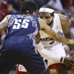 Charlotte Bobcats' Chris Douglas-Robert (55) tries to block Miami Heat's LeBron James (6)