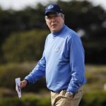 Jeb Bush walks on the 13th hole during the first round of the Pebble Beach National Pro-Am