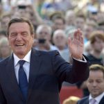Former German Chancellor Schroeder greets the audience as he supports Social Democratic top candidate Steinbrueck (SPD) (not pictured) during an election campaign in Hanover