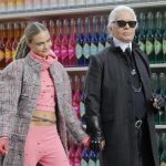 German designer Lagerfeld and model Delevingne appear at the end of his Fall/Winter 2014-2015 women's ready-to-wear collection show for French fashion house Chanel at the Grand Palais transformed into a "Chanel Shopping Center" during Paris Fashion Week