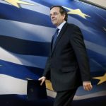 Greece's PM Samaras arrives to address reporters at a news briefing in Athens