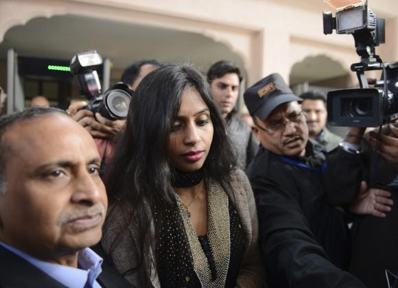 Indian diplomat Khobragade leaves with her father to meet India's Foreign Minister Salman Khurshid in New Delhi
