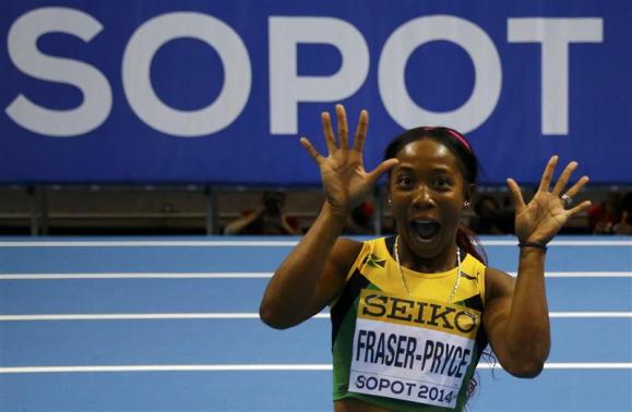 Jamaica's Fraser-Pryce celebrates after winning women's 60m final at world indoor athletics championships in Sopot