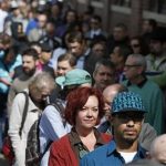 Job seekers line up in the hundreds to attend a marijuana industry job fair