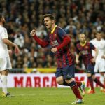 Barcelona's Lionel Messi celebrates after scoring a penalty against Real Madrid during La Liga's second 'classic' soccer match of the season at Santiago Bernabeu stadium in Madrid