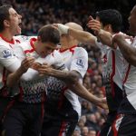 Liverpool's Gerrard celebrates scoring his second penalty against Manchester United during their English Premier League soccer match in Manchester