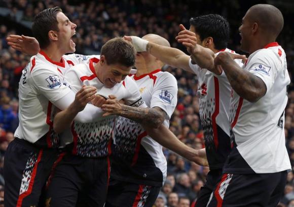 Liverpool's Gerrard celebrates scoring his second penalty against Manchester United during their English Premier League soccer match in Manchester