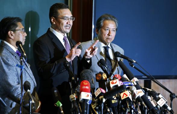 Malaysia's acting Transport Minister Hishammuddin Hussein speaks during a news conference about the missing Malaysia Airlines flight MH370, at Kuala Lumpur International Airport