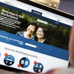 A man looks over the Affordable Care Act signup page on the HealthCare.gov website in New York in this photo illustration
