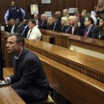 Pistorius sits in court ahead of his trial in Pretoria