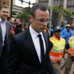 Pistorius leaves court after his trial for the murder of his girlfriend was postponed in Pretoria