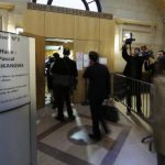 Journalists arrive for the sentence of the trial of former Rwandan army captain Simbikangwa at a Paris court