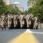 SANDF soldiers parade on the streets near the Union Buildings, where the body of Nelson Mandela will lie in state, in Pretoria