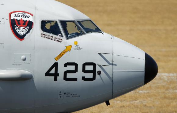 The cockpit crew of a U.S. Navy Poseidon P8 maritime surveillance aircraft are pictured before taking from Perth International Airport