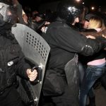 Ukrainian riot police officers block pro-Russian supporters
