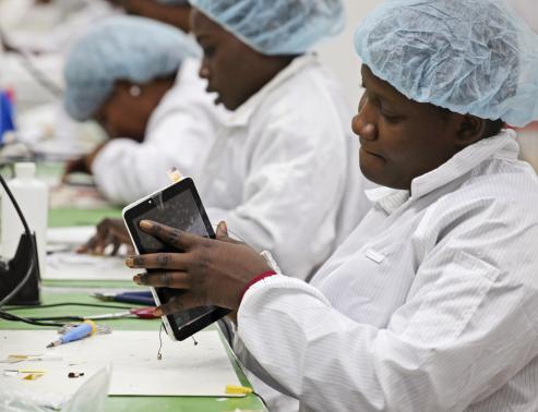 Workers assemble Android-based tablets from imported components at the Surtab factory in Port-au-Prince