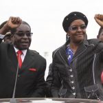 Zimbabwean President Robert Mugabe and his wife Grace wave to supporters and guests during celebrations to mark his 90th birthday in Marondera