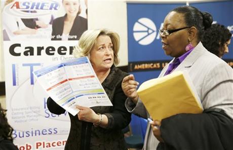 recruiter Valera Kulow, left, speaks with job seeker Monic Spencer