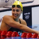 Australia's Stephanie Rice smiles after finishing in third place in heat 5 of the women's 200m individual medley event at the London 2012 Olympic Games at the Aquatics Centre