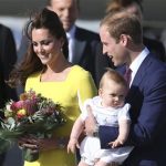 Britain's Prince William holding his son Prince George and his wife Kate