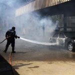 Egypt, Egyptian firefighters try to extinguish a burning vehicle