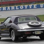 U.S. stock car racing driver Earnhardt Jr. pulls out onto the track in Presley's 1973 Stutz Blackhawk III during a media event at Charlotte Motor Speedway