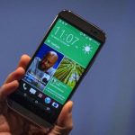 Chou shows the new HTC One M8 phone during a launch event in New York