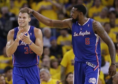 Los Angeles Clippers' Blake Griffin (32) celebrates with teammate DeAndre Jordan (6)