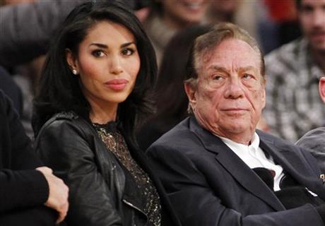 Los Angeles Clippers owner Donald Sterling, right, and V. Stiviano, left