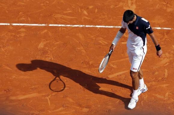 Djokovic reacts after missing a point during his match against Federer during their semi-final match at the Monte Carlo Masters in Monaco