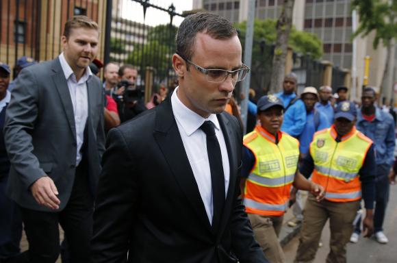 Pistorius leaves court after his trial for the murder of his girlfriend was postponed in Pretoria