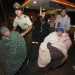 People are evacuated from their shelter after a tsunami alarm at Antofagasta city