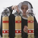 Sister Sancja readies the altar in God’s Mercy sanctuary in Krakow