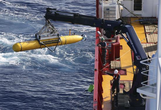 The Bluefin-21 Autonomous Underwater Vehicle is craned over the side of the Australian Defence Vessel Ocean Shield in the southern Indian Ocean during the continuing search for the missing Malaysian Airlines flight MH370