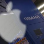 File photo of Sharp Corp logo reflected on Apple Inc's MacBook Pro at an electronics store in Tokyo