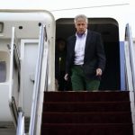 U.S. Defense Secretary Chuck Hagel walks off an aircraft upon his arrival at Yokota Air Force Base in Fussa