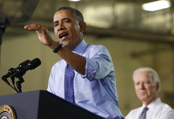 Obama speaks next to Biden after touring the Community College of Allegheny West Hills Center in Oakdale, Pennsylvania