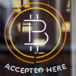 A Bitcoin sign is seen in a window in Toronto