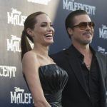 Cast member Jolie and actor Pitt pose at the premiere of "Maleficent" at El Capitan theatre in Hollywood