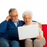 Elderly Couple With Laptop
