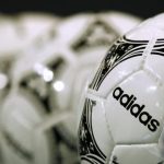 Footballs from Adidas, world's second largest sports apparel firm, are displayed before company annual general meeting in Fuerth
