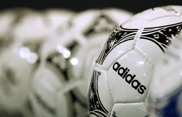 Footballs from Adidas, world's second largest sports apparel firm, are displayed before company annual general meeting in Fuerth