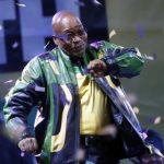 President Jacob Zuma dances at a victory rally of his ruling African National Congress (ANC) in Johannesburg