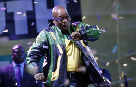 President Jacob Zuma dances at a victory rally of his ruling African National Congress (ANC) in Johannesburg