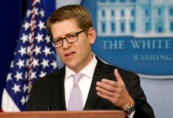 White House press secretary Carney answers questions about health insurance during a briefing at the White House in Washington