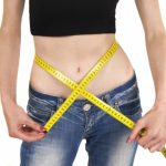 Lady Measuring Weight Loss - by sattva