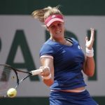 Maria-Teresa Torro-Flor of Spain returns a forehand to Simona Halep of Romania during their women's singles match at the French Open tennis tournament at the Roland Garros stadium in Paris