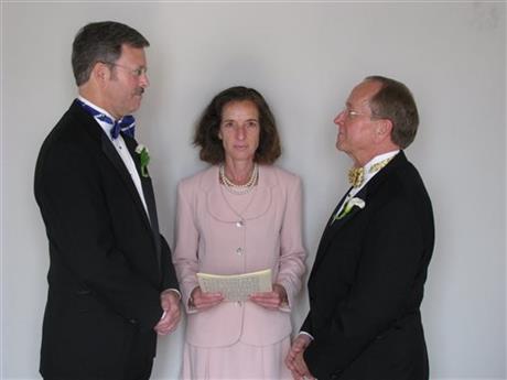 Mark Andrew, left, and Bishop V. Gene Robinson
