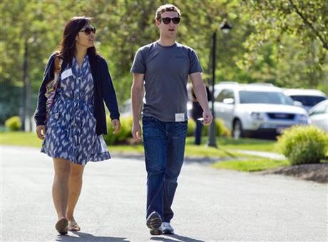 Mark Zuckerberg walks to morning sessions with his then girlfriend Priscilla Chan